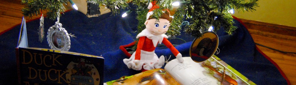 Our Elf on the Shelf Reading While Sitting Under the Christmas Tree|Sharon the Moments blog